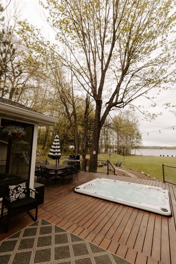 Private hot tub on the deck at Camp Digs, a family-friendly cabin getaway in Northwestern Wisconsin