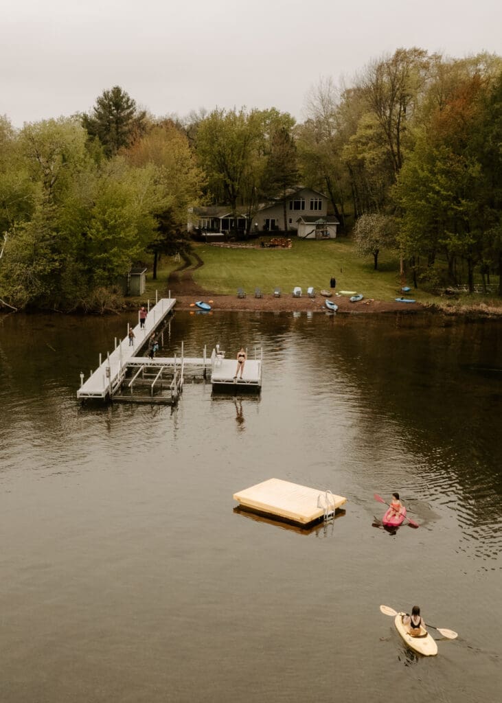 Aerial view of Camp Digs, a family-friendly cabin getaway Wisconsin surrounded by forest and water